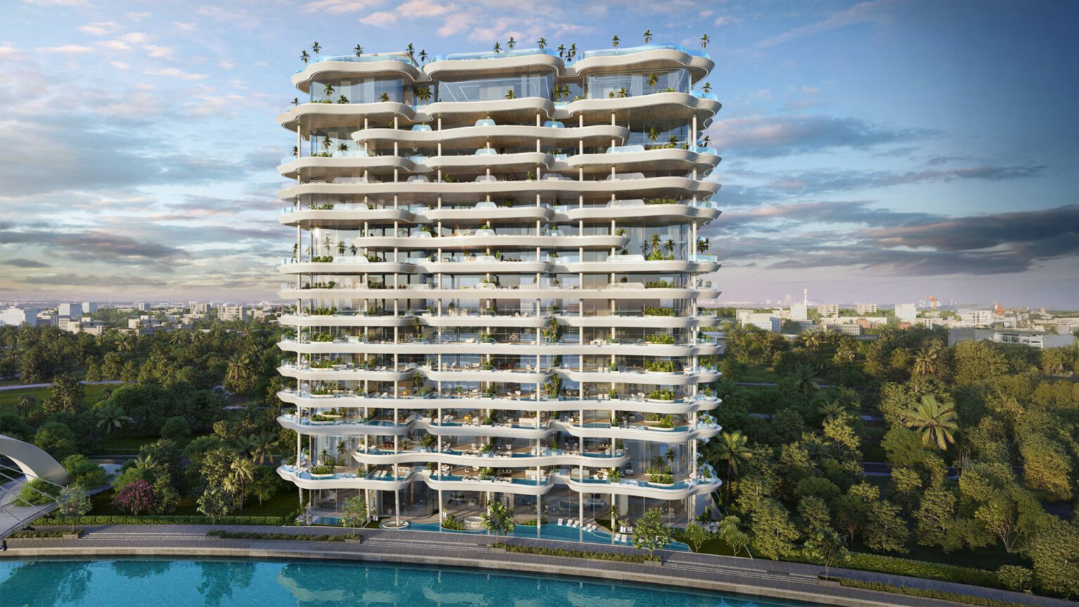 Casa Canal tiered residential tower with layered planted sky terraces above a waterfront pool at dusk