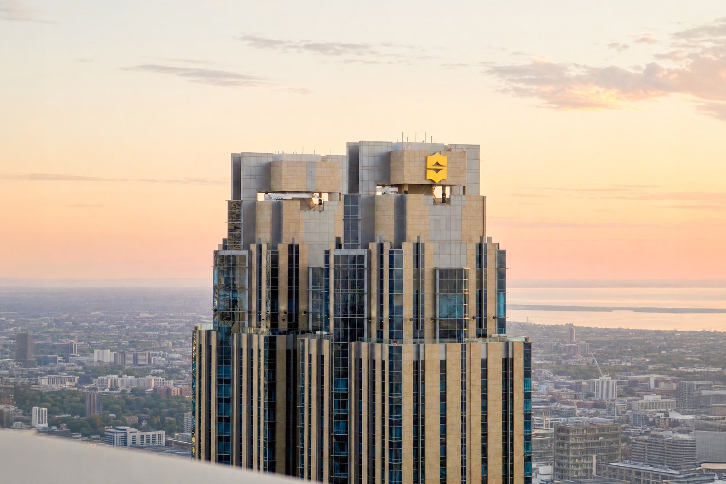 High-rise tower crown overlooking the city skyline at dusk, AHS Properties media feature